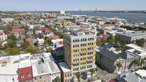 Drone photos of the Peoples Building with the Ravenel Bridge in the background
